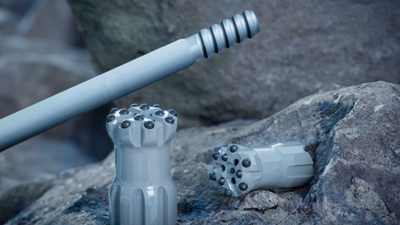 Epiroc Grey Line Bits And Rod On Rocks.Jpg